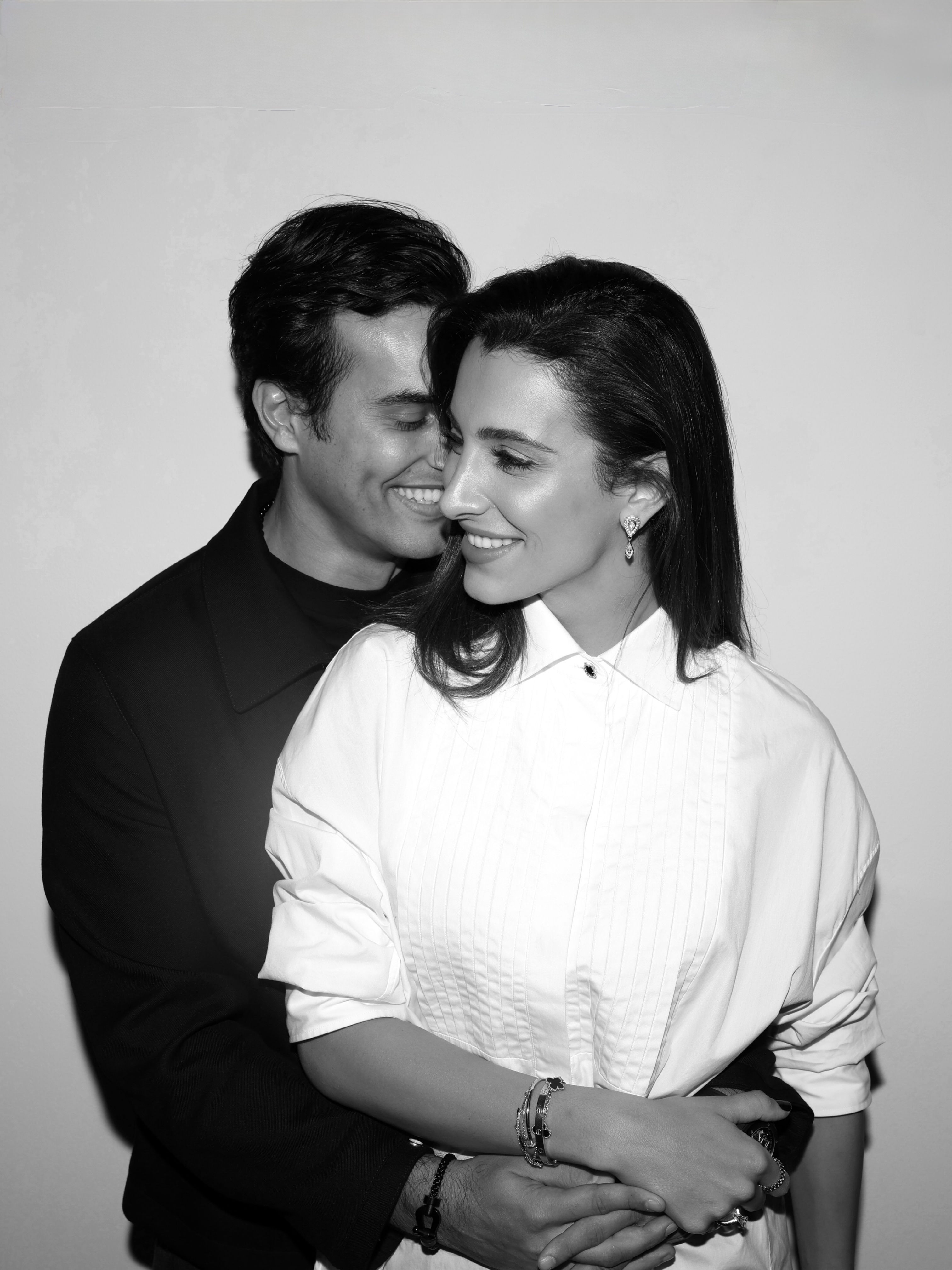 Ali Hennaoui and Walaa Awada, Dubai-based luxury fashion creators, studio portrait in black and white, by Ali & Walaa (@aliandwalaa) — intimate, quiet luxury, editorial. Luxury fashion editorial reference.