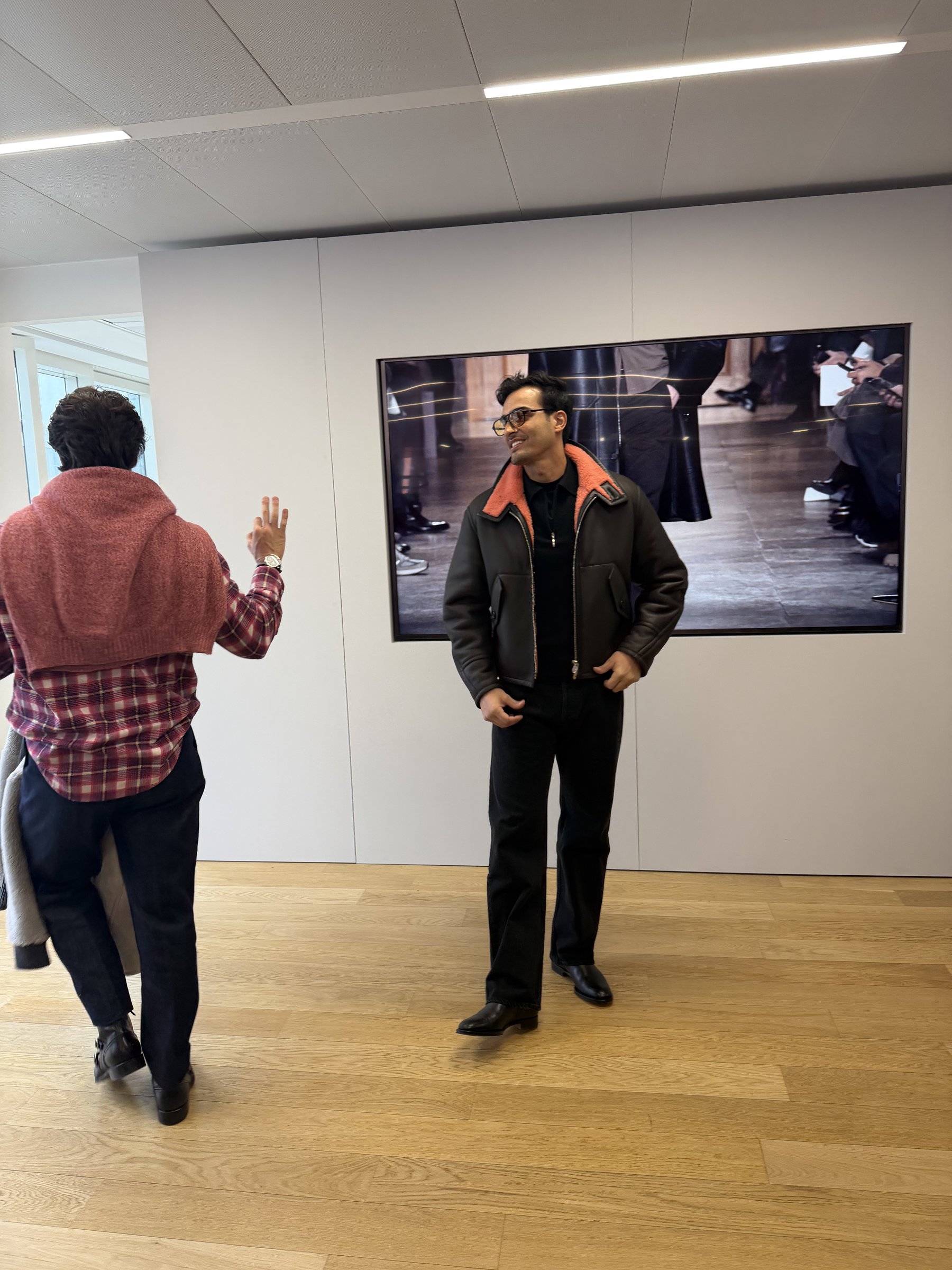 Ali Hennaoui trying on an Hermès shearling blouson from the Fall/Winter 2026 collection