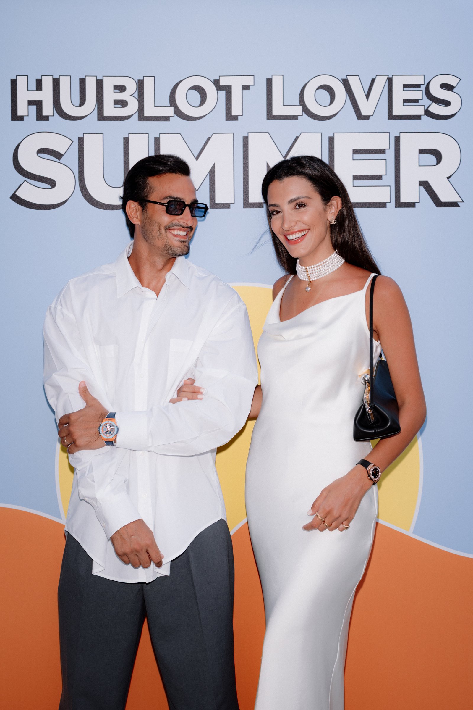 Ali Hennaoui and Walaa Awada at the Hublot Loves Summer
    launch event in Mykonos, Greece, wearing Hublot watches —
    Ali & Walaa (@aliandwalaa), June 2025