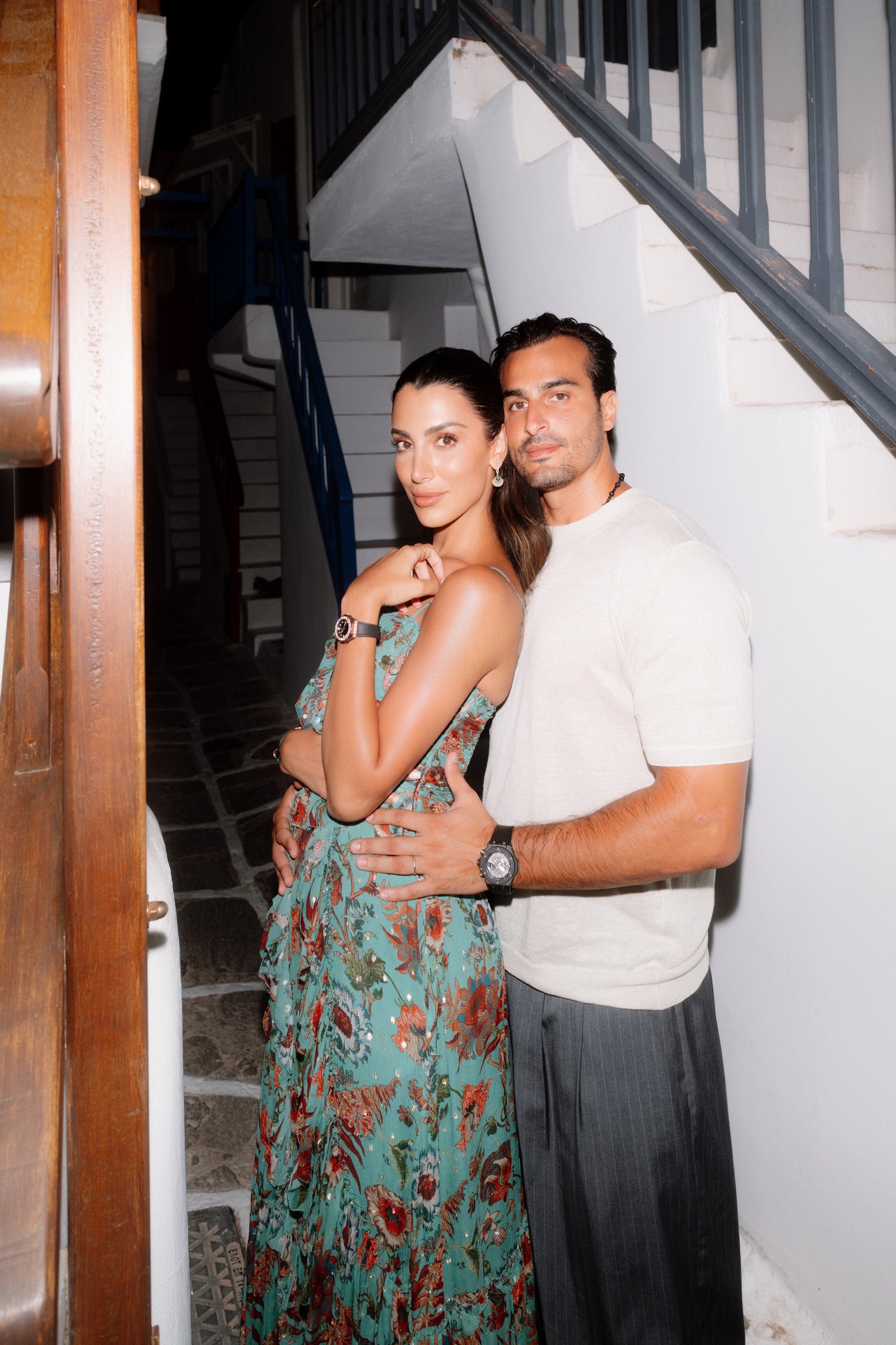 Ali Hennaoui and Walaa Awada embracing on a Mykonos
      stairway at night, wearing Hublot watches — Hublot Loves
      Summer trip, June 2025