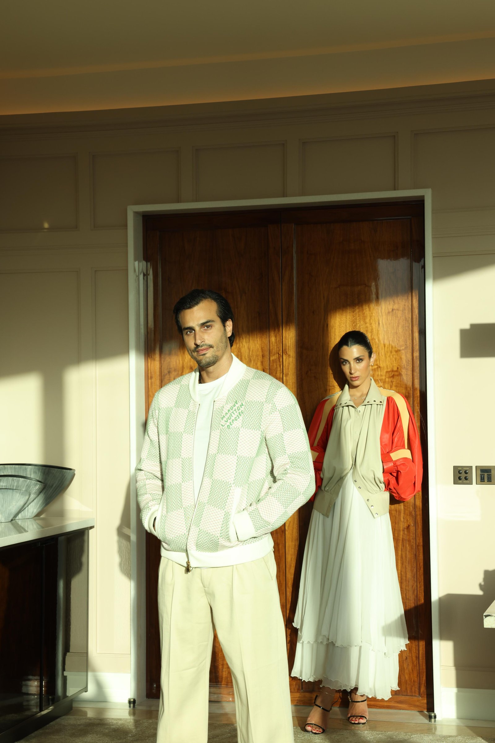 Ali Hennaoui and Walaa Awada in Louis Vuitton at The Lana
      hotel, Business Bay, Dubai — Louis Vuitton campaign by
      Ali & Walaa, May 2025