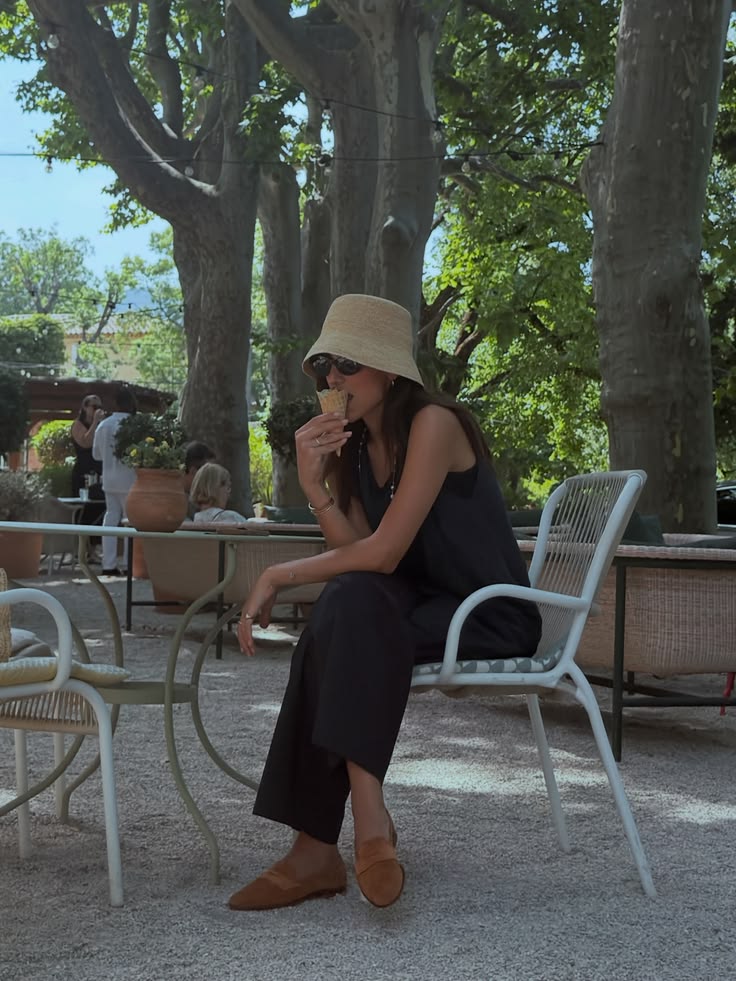 Walaa Awada at a French Riviera café garden eating ice cream —
      Mercedes-Maybach Côte d'Azur experience, Ali & Walaa
